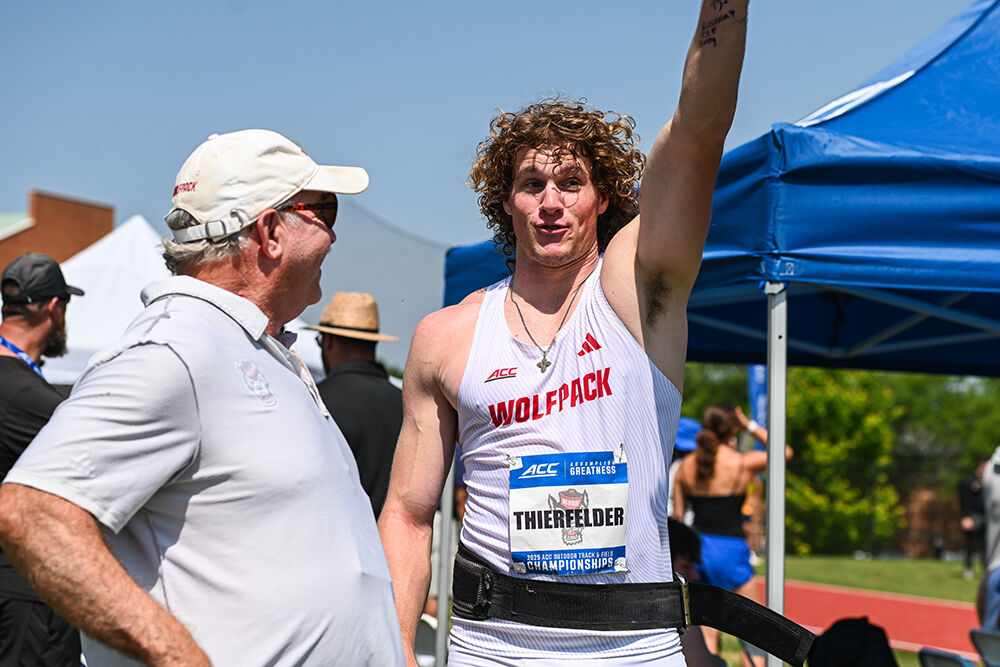 Junior javelin thrower Luke Thierfelder talks with assistant coach Tom Wood during the ACC Outdoor Track and Field Championships in the Wake Forest University Throws Field on Thursday, May 15, 2025. Thierfelder placed fifth with a throw of 63.16 meters.