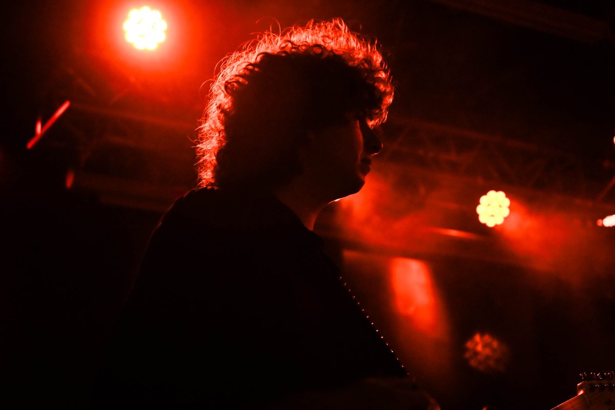 Guitarist and vocalist Nick Kivlen looks out into the crowd while performing with Sunflower Bean at Kings on Saturday, May 24, 2025. Kivlen played alongside band members Julia Cumming and Olive Faber.