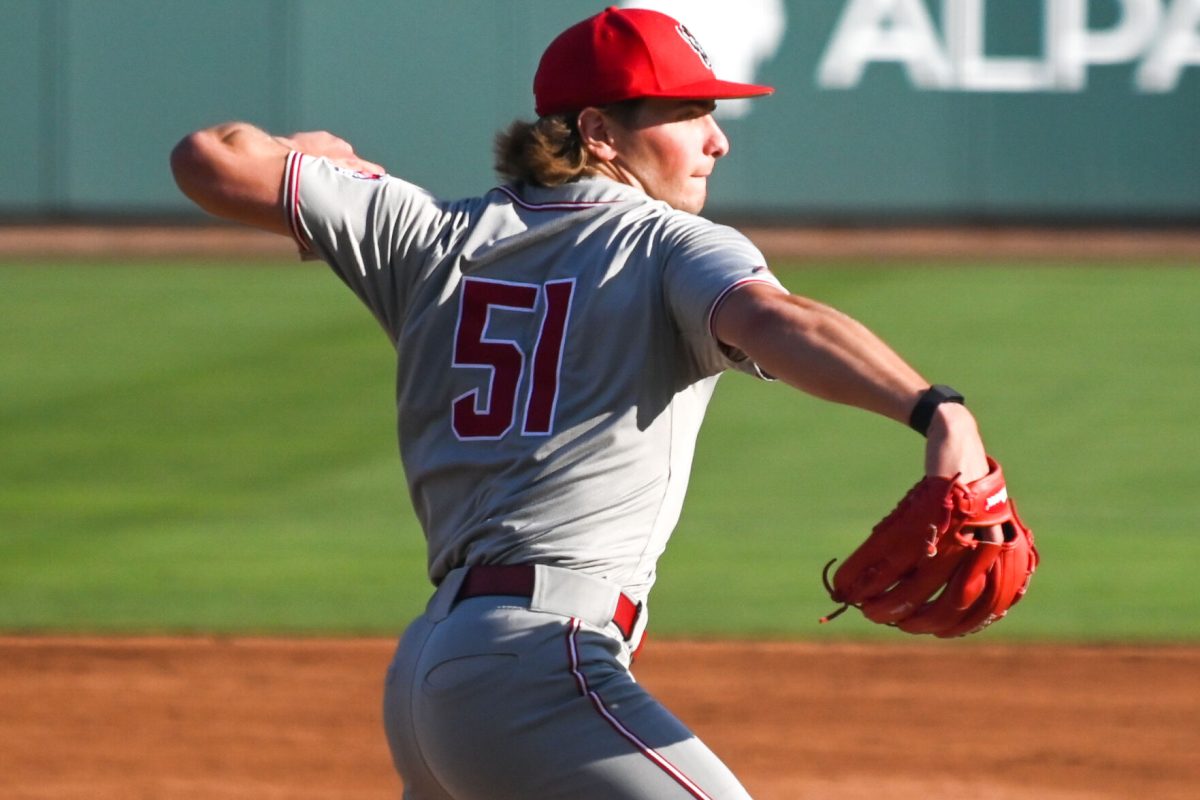 Junior left-handed pitcher Dominic Fritton throws to first during the game against UNC at Boshamer Stadium on Friday, May 9, 2025. Fritton pitched 6.0 innings and tallied seven strikeouts. NC State beat UNC 8-5.