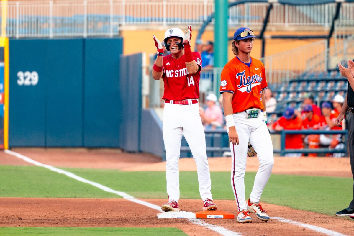 Freshman outfielder Ty Head claps his hands after getting a hit during the quarterfinals of the ACC Baseball Tournament&#160;against Clemson in Durham Bulls Athletic Park on Thursday, May 22, 2025. Head had three hits and scored one run. NC State lost to Clemson 7-6.