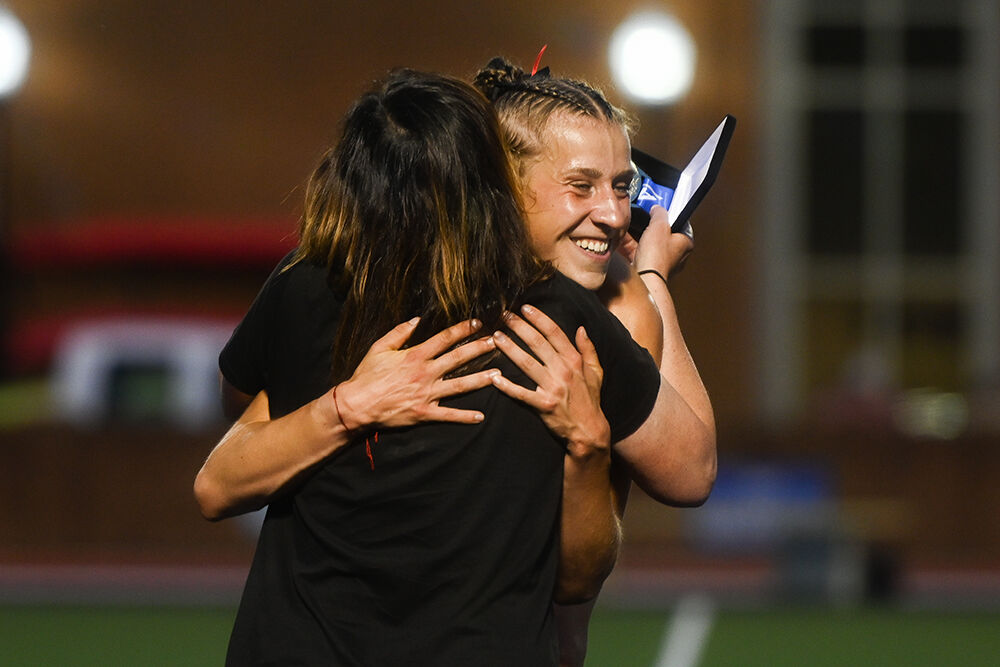 Sophomore distance runner Angelina Napoleon hugs director Laurie Henes after winning the women's 3000m steeplechase during the ACC Outdoor Track and Field Championships in Kentner Stadium on Friday, May 16, 2025. Napoleon won the championship with a personal best time of 9:27.85, setting a meet record.
