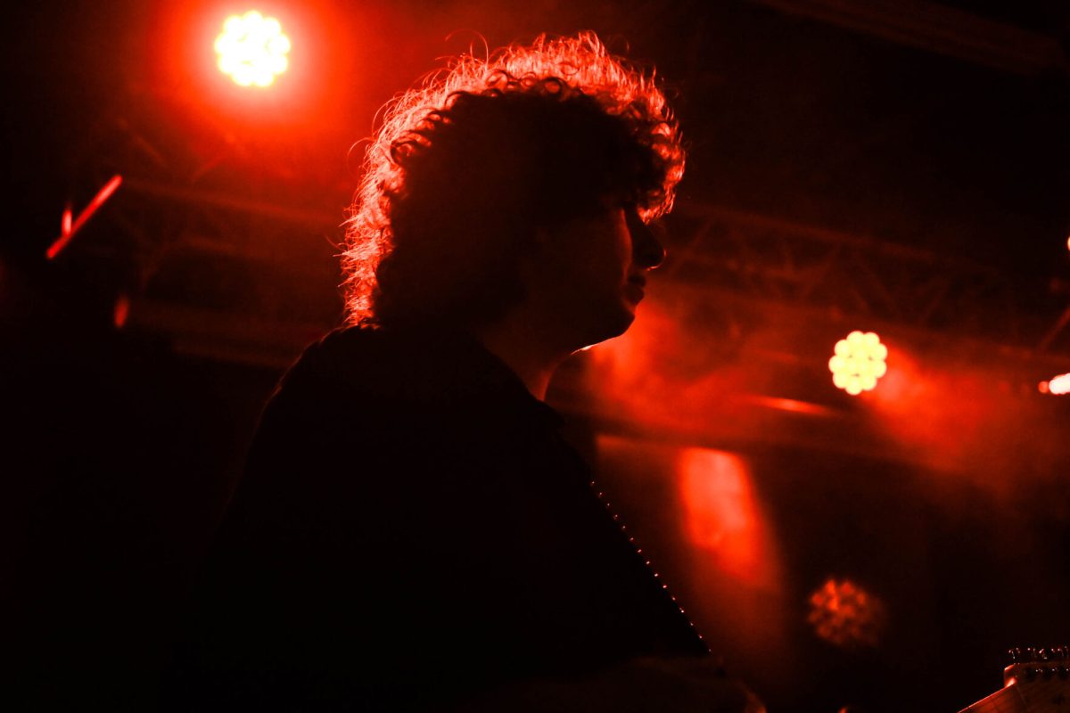 Guitarist and vocalist Nick Kivlen looks out into the crowd while performing with Sunflower Bean at Kings on Saturday, May 24, 2025. Kivlen played alongside band members Julia Cumming and Olive Faber.