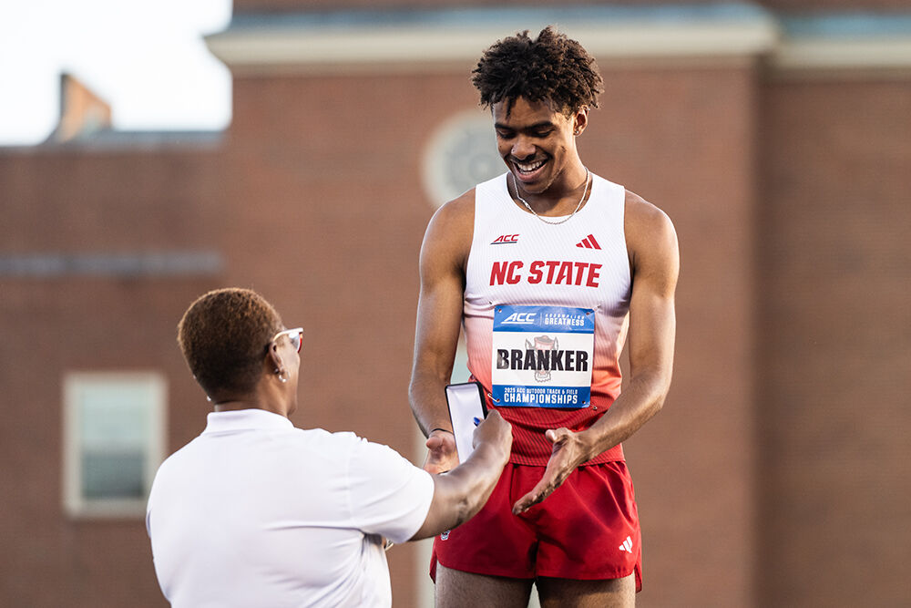 Sophomore hurdler Xavier Branker receives his medal after placing second in the men's 400m hurdles event during the ACC Outdoor Track and Field Championships in Kentner Stadium on Saturday, May 18, 2025. Branker finished the race with a time of 49.69, a personal best.