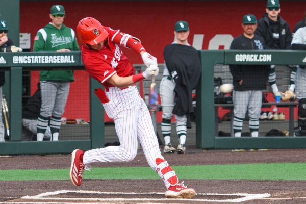 Freshman infielder Ryder Woodson takes a swing at the ball during the game against Wright State on Doak Field at Dail Park on Friday, March 7, 2025. Woodson scored one of the six runs for the Wolfpack. The Wolfpack won against the Raiders 6-4.