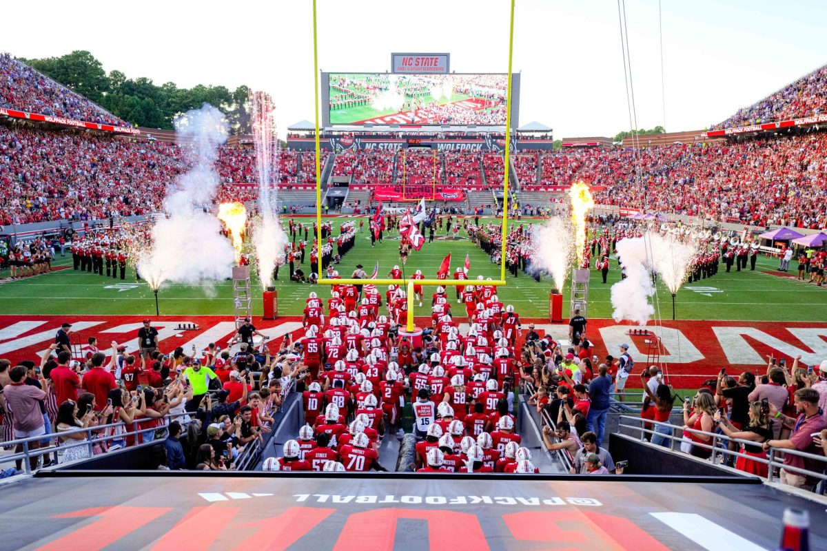 NC State football team enters the field for their game against East Carolina at Carter-Finley Stadium on Thursday, Aug. 28, 2025. NC State beat ECU 24-17.