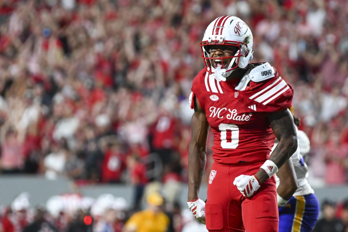 Redshirt senior linebacker Sean Brown celebrates by yelling during the game against East Carolina at Carter-Finley Stadium on Thursday, Aug. 28, 2025. Brown had 10 total tackles. NC State beat ECU 24-17.