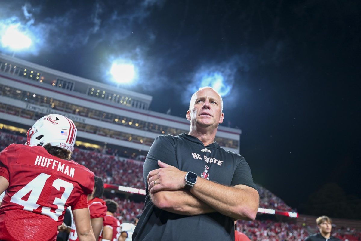 NC State head football coach Dave Doeren looks out into the field after the game against East Carolina at Carter-Finley Stadium on Thursday, Aug. 28, 2025. NC State beat ECU 24-17.
