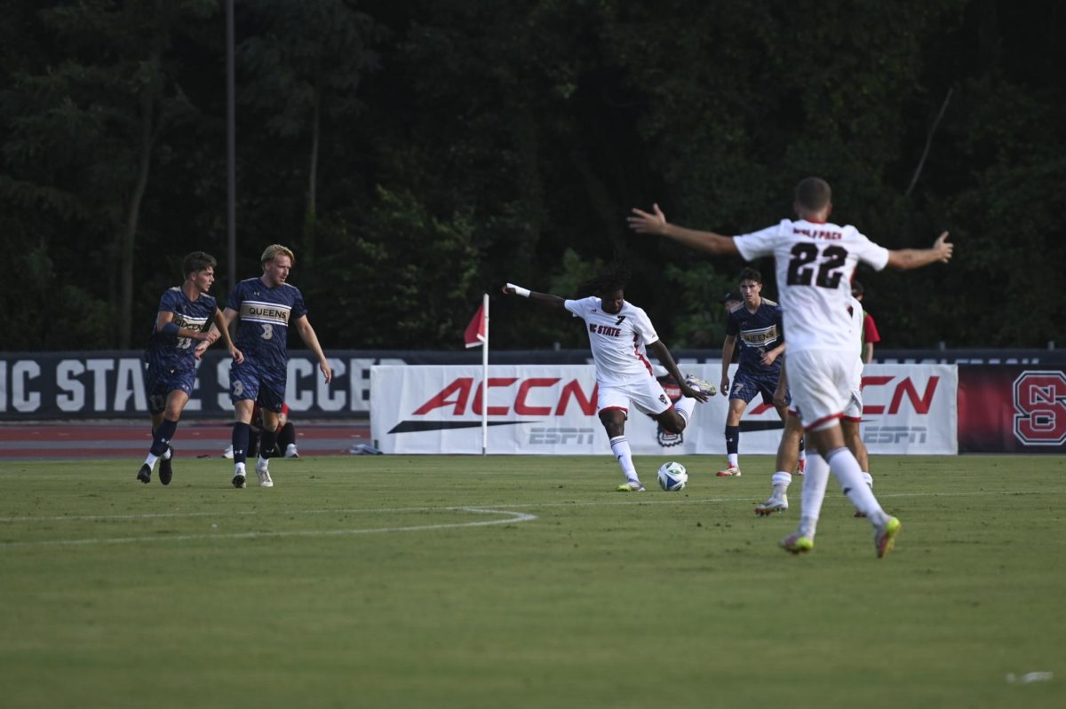 Junior forward Donavan Phillip takes a shot against Queens. The Wolfpack defeated the Royals 2-0 to open the 2025 season on Aug. 21. 