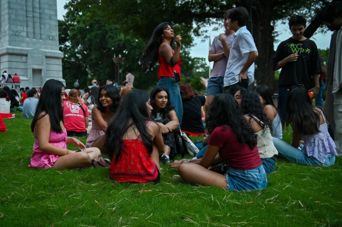 
Olivia Chen, a first-year in biology and public policy, Risha Phadnis, a first-year in biology, Bindi Parikh, a first-year in neuroscience and Janvi Patel, a first-year in mechanical engineering sit by the Belltower during Packapalooza on Saturday, Aug. 23, 2025. Packapalooza is NC State's annual block party to kick off Wolfpack Welcome Week.