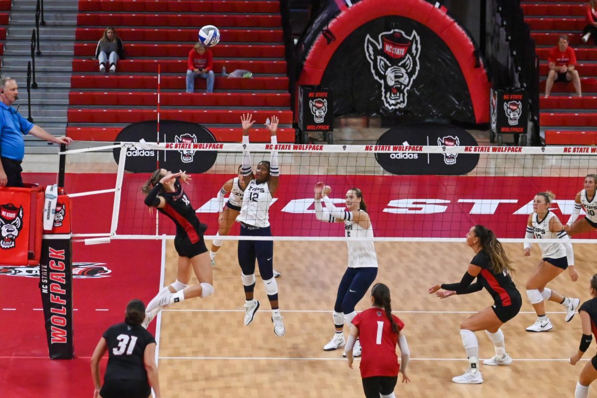 Senior outside hitter Courtney Bryant spikes a point against Akron in Reynolds Coliseum on Friday, Aug. 29, 2025. Courtney Bryant achieved 5 spikes as of 2025. NC State beat Akron 3-2.