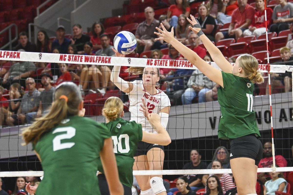 Senior outside hitter Courtney Bryant hits the ball over the net during the volleyball match against Green Bay in Reynolds Coliseum on Saturday, Aug. 30, 2025. Bryant scored 11.5 points. NC State beat Green Bay 3-2.