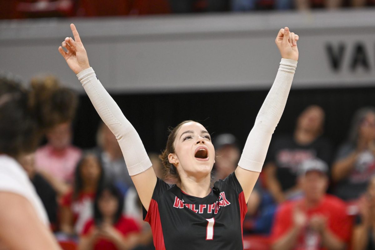 Freshman libero Zuzia Maciejewicz celebrates her team getting a point during the volleyball match against Green Bay in Reynolds Coliseum on Saturday, Aug. 30, 2025.  Maciejewicz had 26 digs. NC State beat Green Bay 3-2.