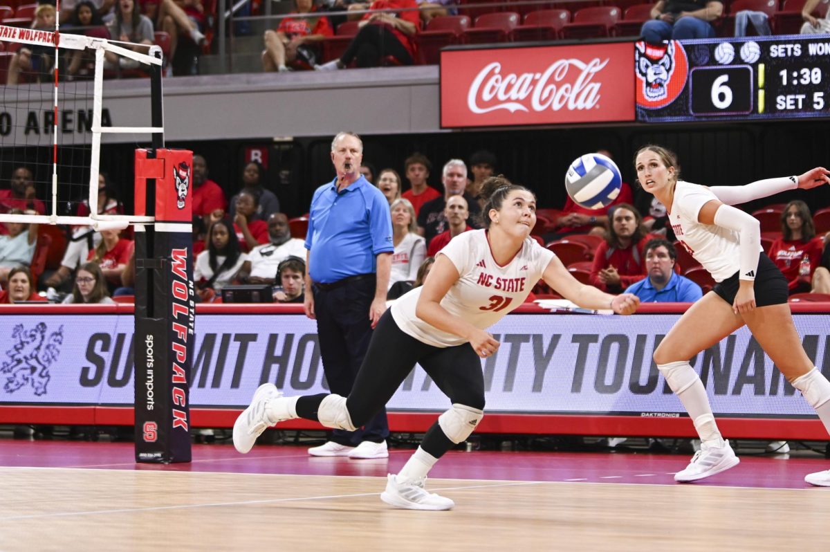 Redshirt junior setter Elaisa Villar reaches for the ball during the volleyball match against Green Bay in Reynolds Coliseum on Saturday, Aug. 30, 2025. Villar had two service aces and 19 assists. NC State beat Green Bay 3-2.