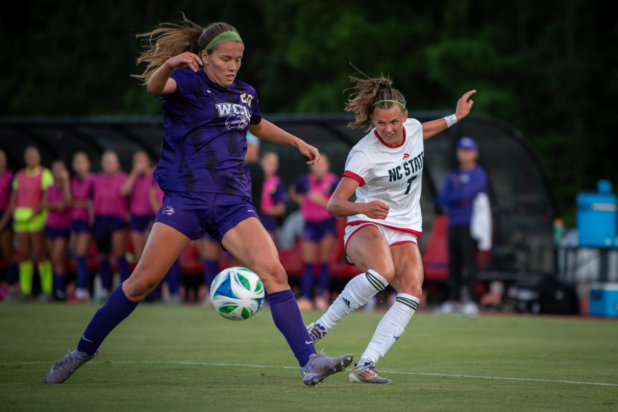 Redshirt junior forward Erica Roberts slices the ball past a defender during the game against Western Carolina at Dail Soccer Stadium on Wednesday, Aug. 27, 2025. The Wolfpack lost to the Catamounts 3-2.