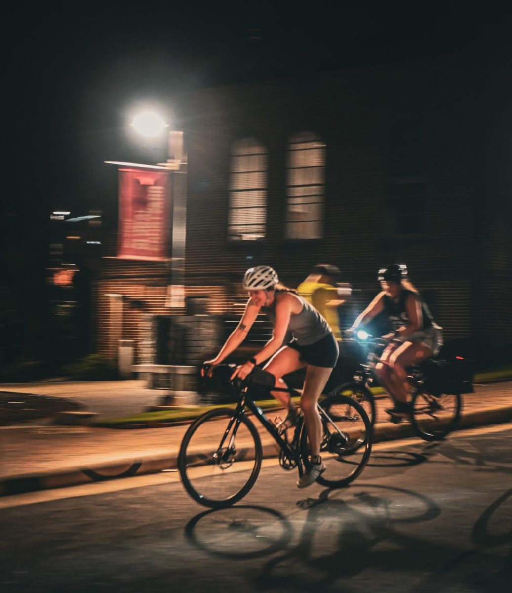 Members of the NC State Cycling Club officially start the Moonlight Howl and Run. The Cycling Club starts the fun run at the front of the pack, leading participants from the Memorial Belltower to Stafford Commons on a path that runs through NC State’s Main Campus.