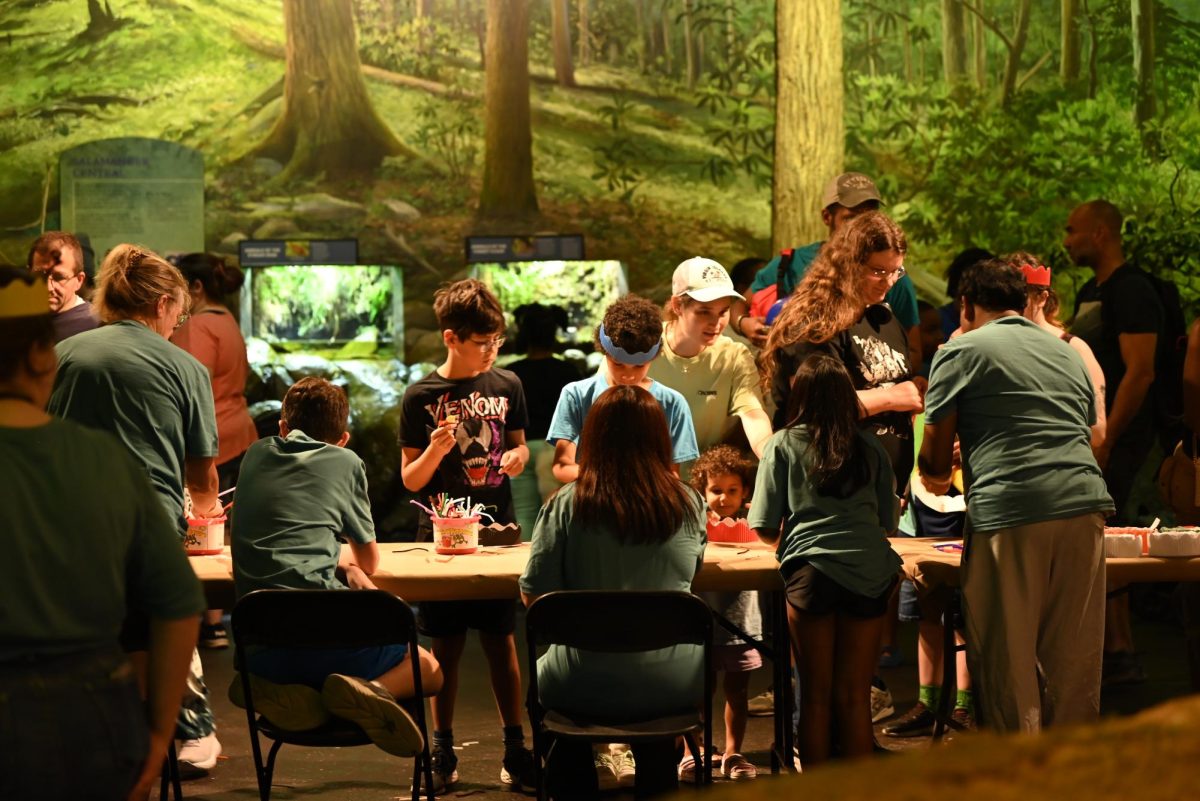 Visitors make their own antenna hats during Bugfest at the Raleigh Museum of Natural Science on Saturday, Sept 20, 2024. The event was open to the public with food trucks, vendors and volunteers.