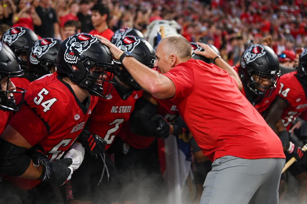 Head coach Dave Doeren hypes the football players up in the tunnel before the game against Virginia Tech at Carter-Finley Stadium on Saturday, Sept. 27, 2025. NC State lost to Virginia Tech 23-21.