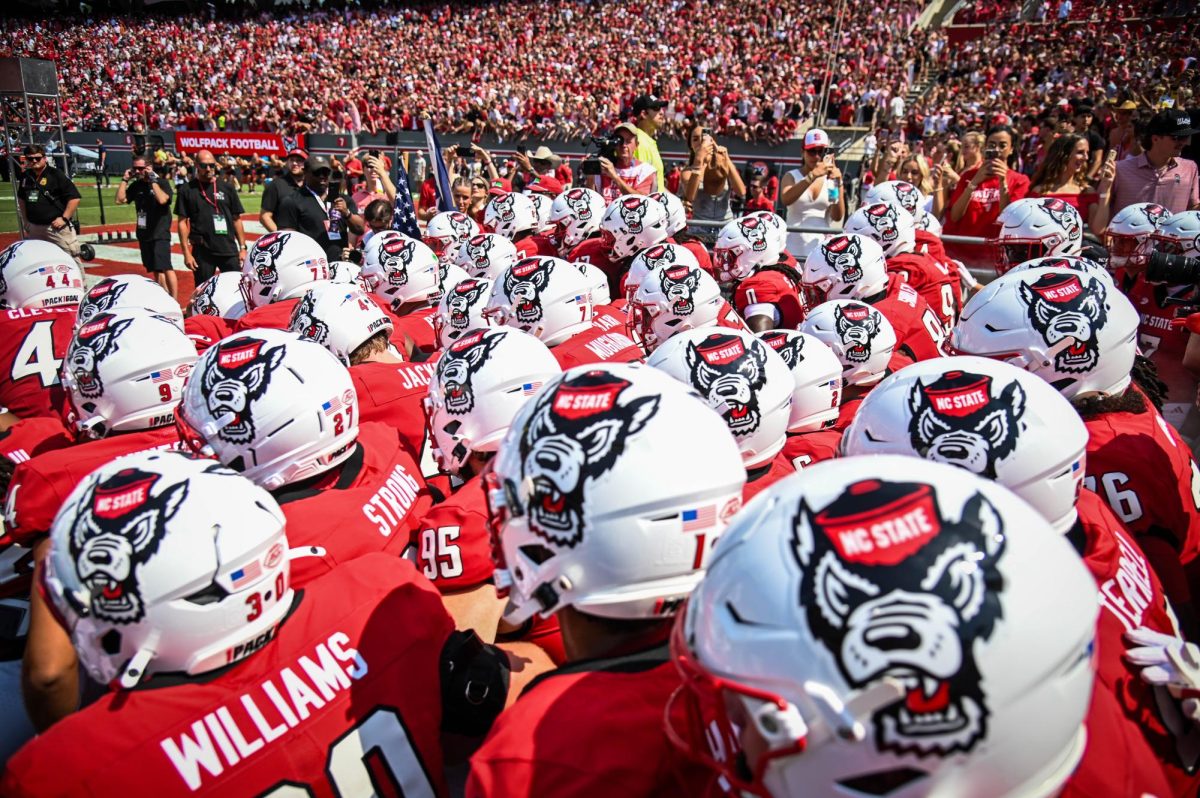 NC State's football team prepares to enter the field before the game against Virginia in Carter-Finley Stadium on Saturday, Sept. 6, 2025. The Wolfpack beat the Cavaliers 35-31.