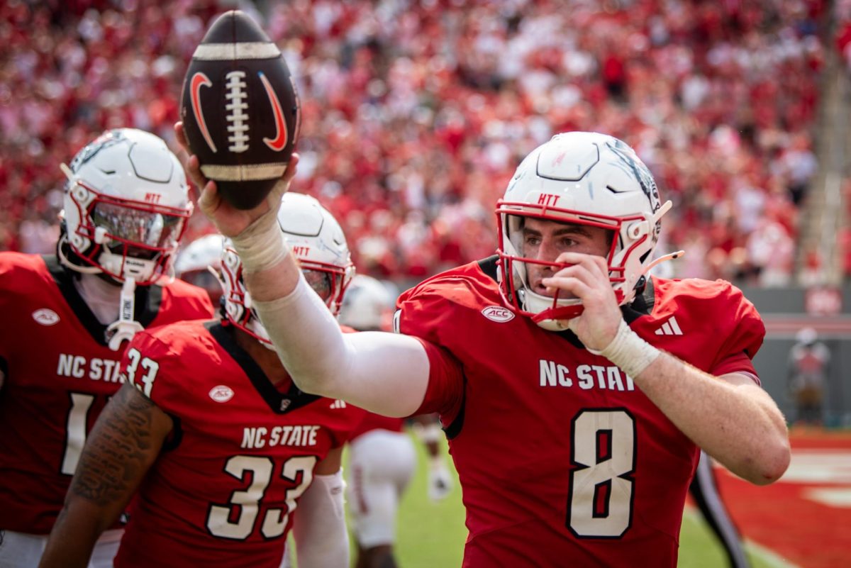 Graduate linebacker Cian Slone holds up the ball from his game-sealing interception during the game against Virginia in Carter-Finley Stadium on Saturday, Sep. 6, 2025. Slone had four total tackles and one interception. The Wolfpack beat the Cavaliers 35-31.