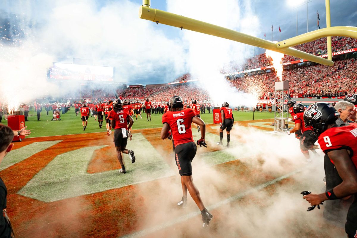 Senior wide receiver Wesley Grimes runs out of the tunnel and enters the field before the game against Virginia Tech on Saturday, Sept. 27, 2025. Grimes caught three receptions for 36 yards. NC State lost to Virginia Tech 23-21.