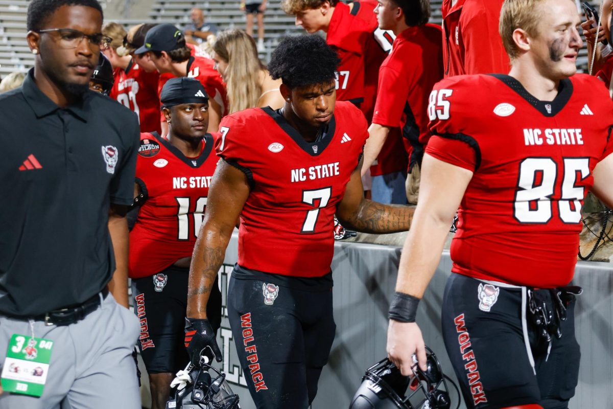 Senior tight end Justin Joly walks off the field with his head down after the game against Virginia Tech on Saturday, Sept. 27, 2025. Joly caught six receptions for 60 yards. NC State lost to Virginia Tech 23-21.