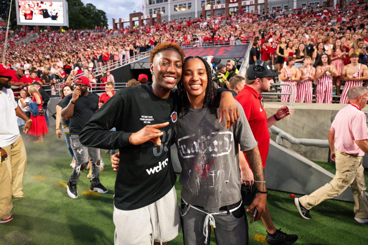 Alpha Wolves Saniya Rivers and Aziaha James pose for a photo before the game against Virginia Tech on Saturday, Sept. 27, 2025. NC State lost to Virginia Tech 23-21.