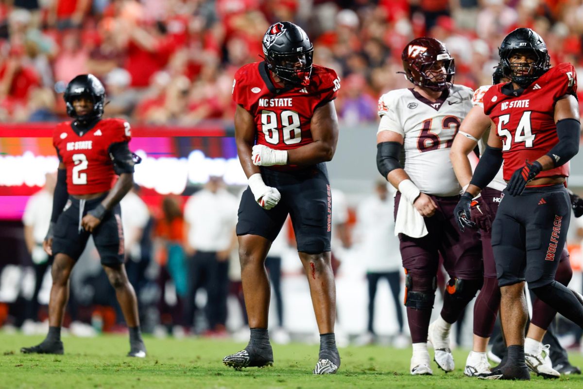 Redshirt sophomore defensive end Isaiah Shirley celebrates getting a tackle during the game against Virginia Tech on Saturday, Sept. 27, 2025. Shirley had two tackles. NC State lost to Virginia Tech 23-21.