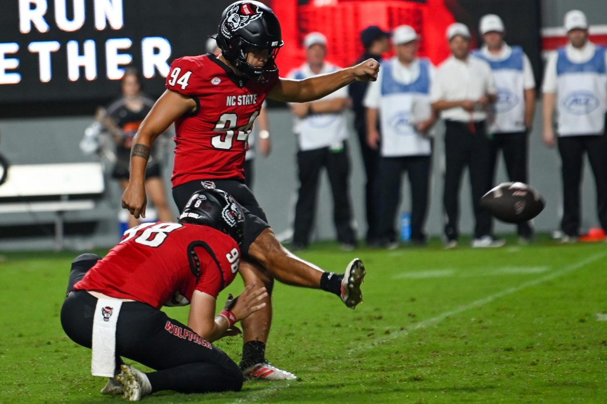 Redshirt junior kicker Kanoah Vinesett kicks the ball during the game against Virginia Tech at Carter-Finley Stadium on Saturday, Sept. 27, 2025. Vinesett had three points. The Wolfpack fell to the Hokies 23-21.