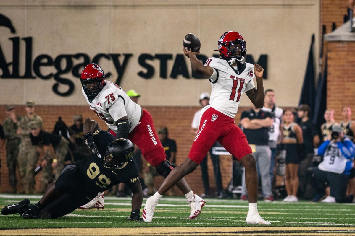 Sophomore quarterback CJ Bailey throws the ball during the game against Wake Forest in Allegacy Stadium on Thursday, Sept. 11, 2025. Baliey threw for 201 yards and three touchdowns. The Wolfpack beat the Demon Deacons 34-24.