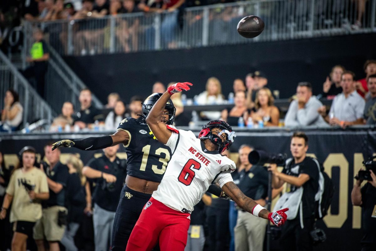 Senior wide reciever Wesley Grimes looks for the ball after it was deflected during the game against Wake Forest in Allegacy Stadium on Thursday, Sept. 11, 2025. The Wolfpack beat the Demon Deacons 34-24.