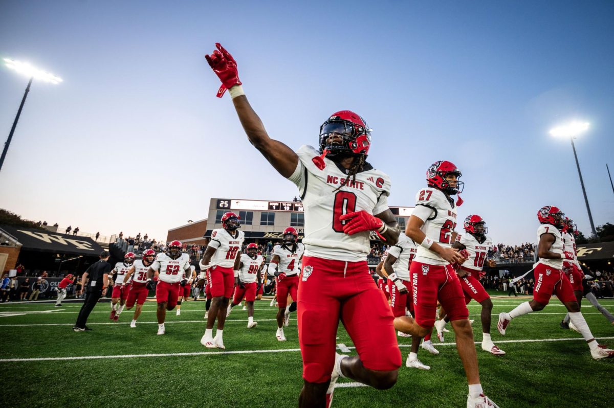 Redshirt senior linebacker Sean Brown points to the crowd as NC State runs onto the field before the game against Wake Forest in Allegacy Stadium on Thursday, Sept. 11, 2025. The Wolfpack beat the Demon Deacons 34-24.