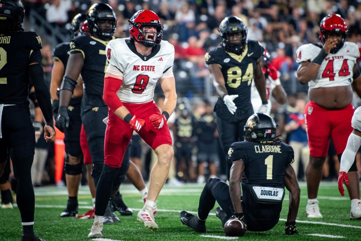 Graduate linebacker Cian Slone flexes after a tackle during the game against Wake Forest in Allegacy Stadium on Thursday, Sept. 11, 2025. The Wolfpack beat the Demon Deacons 34-24.