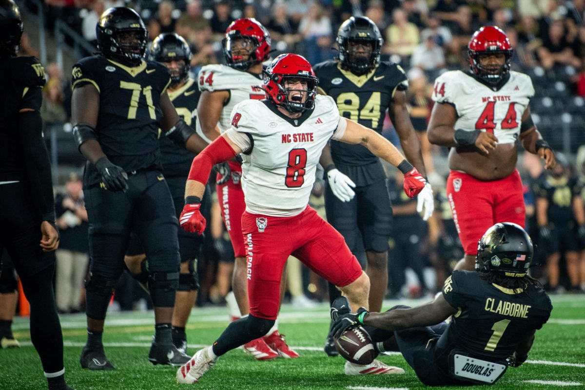 Graduate linebacker Cian Slone celebrates a tackle during the game against Wake Forest in Allegacy Stadium on Thursday, Sept. 11, 2025. The Wolfpack beat the Demon Deacons 34-24.
