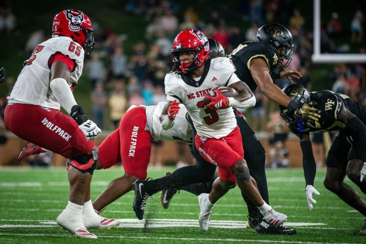 Redshirt sophomore runningback Hollywood Smothers rushes the ball during the game against Wake Forest in Allegacy Stadium on Thursday, Sept. 11, 2025. Smothers led all rushers with 164 yards. The Wolfpack beat the Demon Deacons 34-24.