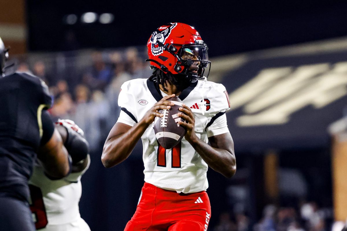 Sophomore quarterback CJ Bailey surveys the field during the game against Wake Forest in Allegacy Stadium on Thursday, Sept. 11, 2025. Baliey threw for 201 yards and three touchdowns. The Wolfpack beat the Demon Deacons 34-24.
