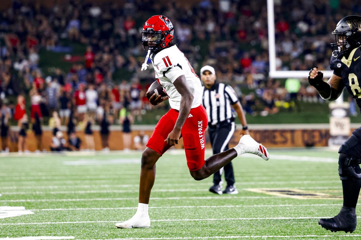 Sophomore quarterback CJ Bailey runs towards the endzone during the game against Wake Forest in Allegacy Stadium on Thursday, Sept. 11, 2025. Baliey threw for 201 yards and rushed for 30 yards. The Wolfpack beat the Demon Deacons 34-24.