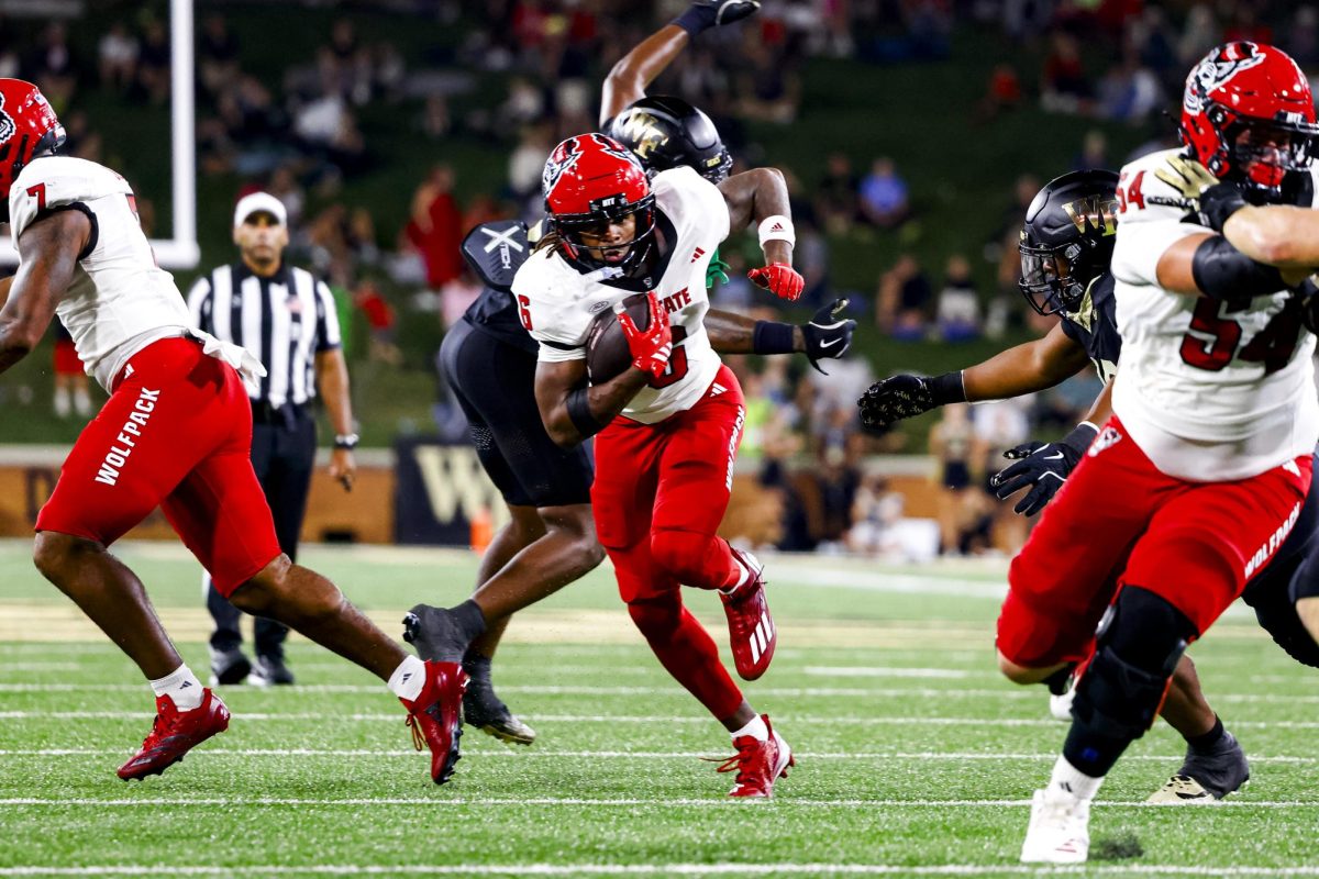 Junior wide receiver Wesley Grimes evades a tackle during the game against Wake Forest in Allegacy Stadium on Thursday, Sept. 11, 2025. Grimes had three receptions for 19 yards. The Wolfpack beat the Demon Deacons 34-24.