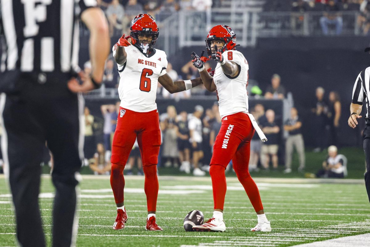 Junior receiver Wesley Grimes and sophomore receiver Keenan Jackson point forward after getting a first down during the game against Wake Forest in Allegacy Stadium on Thursday, Sept. 11, 2025. Jackson caught three receptions for 46 yards. The Wolfpack beat the Demon Deacons 34-24.