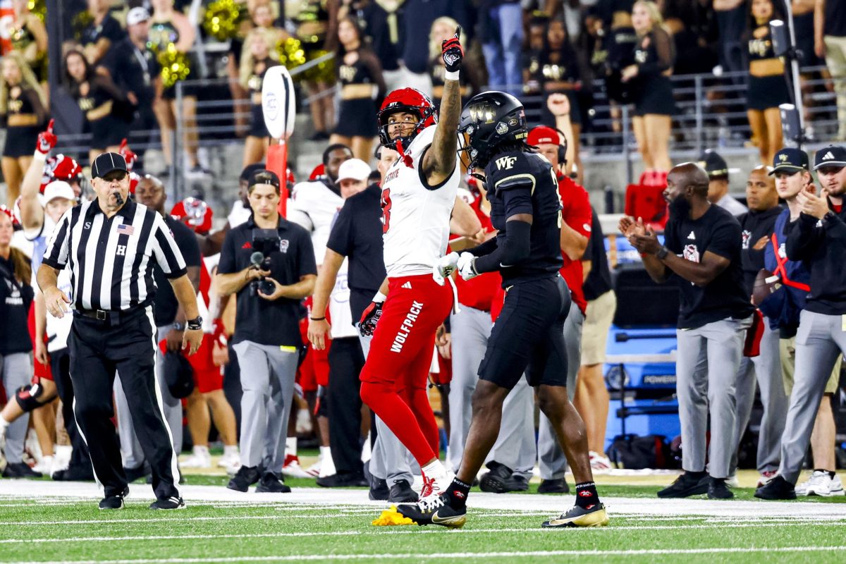 Sophomore receiver Keenan Jackson points toward the endzone after getting a first down during the game against Wake Forest in Allegacy Stadium on Thursday, Sept. 11, 2025. Jackson caught three receptions for 46 yards and one touchdown. The Wolfpack beat the Demon Deacons 34-24.