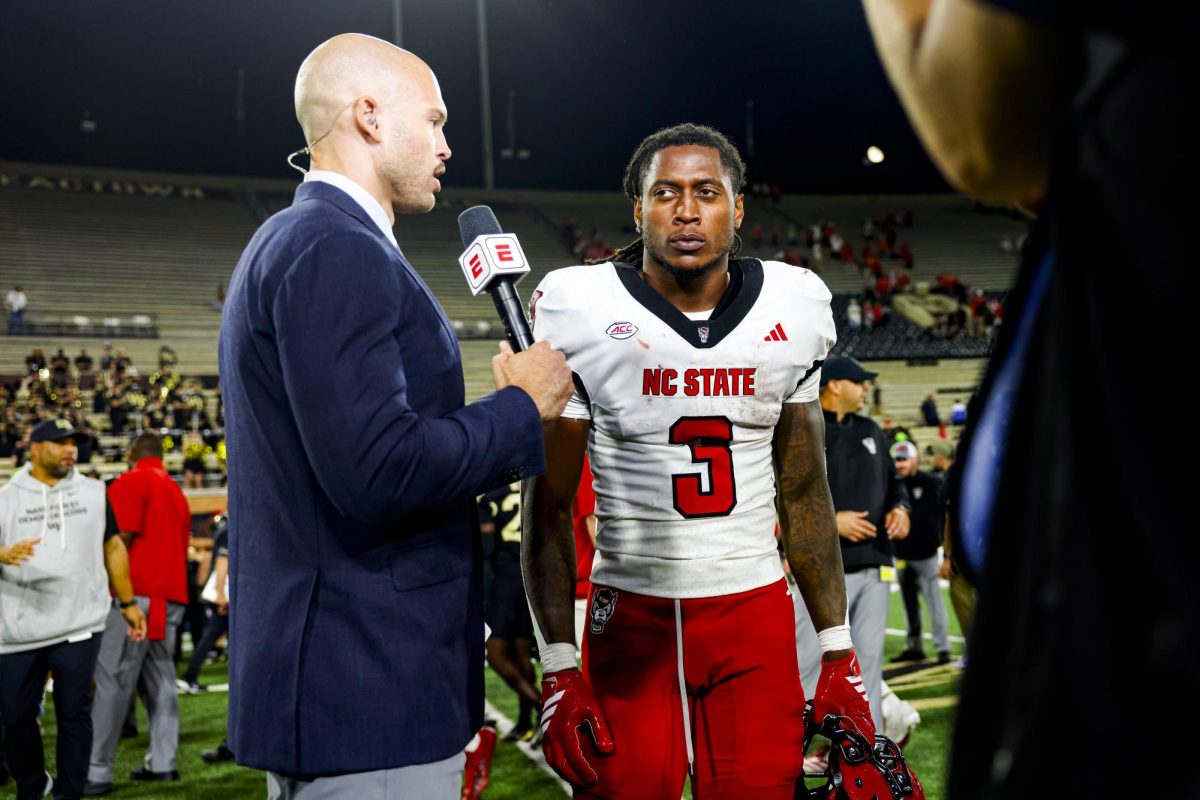 Redshirt sophomore running back Daylen “Hollywood” Smothers talks with sideline reporter Tony Haynes after the game against Wake Forest in Allegacy Stadium on Thursday, Sept. 11, 2025. Smothers rushed for 164 yards. The Wolfpack beat the Demon Deacons 34-24.