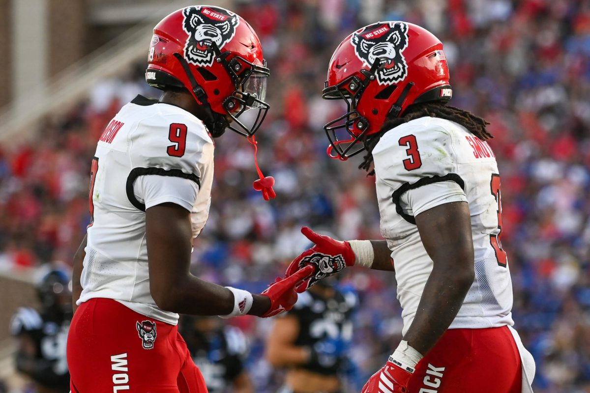 Redshirt-sophomore running back Hollywood Smothers and sophomore wide receiver Terrell Anderson celebrate after a touchdown during the game against Duke at Wallace Wade Stadium on Saturday, Sept 20. 2025. Anderson and Smothers had three combined touchdowns. NC State fell to Duke 45-33.