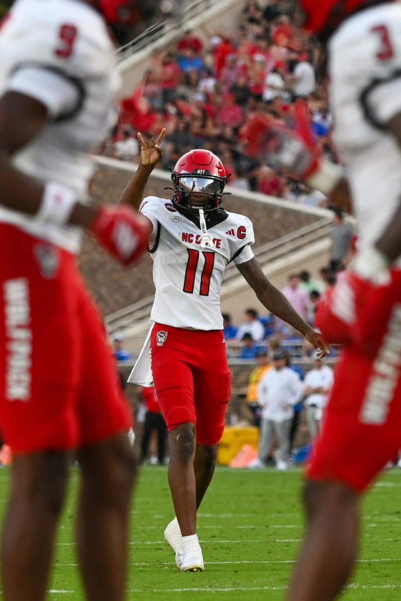 Sophomore quarterback CJ Bailey celebrates after a touchdown pass during the game against Duke at Wallace Wade Stadium on Saturday, Sept 20. 2025. Bailey had two passing touchdowns and averaged nine yards in the air. NC State fell to Duke 45-33.
