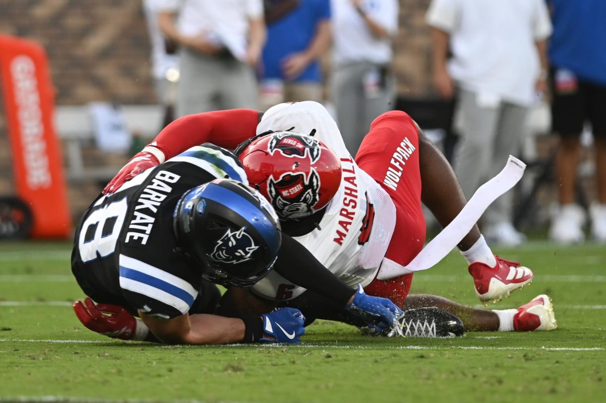 Senior cornerback Devon Marshall tackles a rival receiver during the game against Duke at Wallace Wade Stadium on Saturday, Sept. 20, 2025. NC State lost to Duke 45-33.