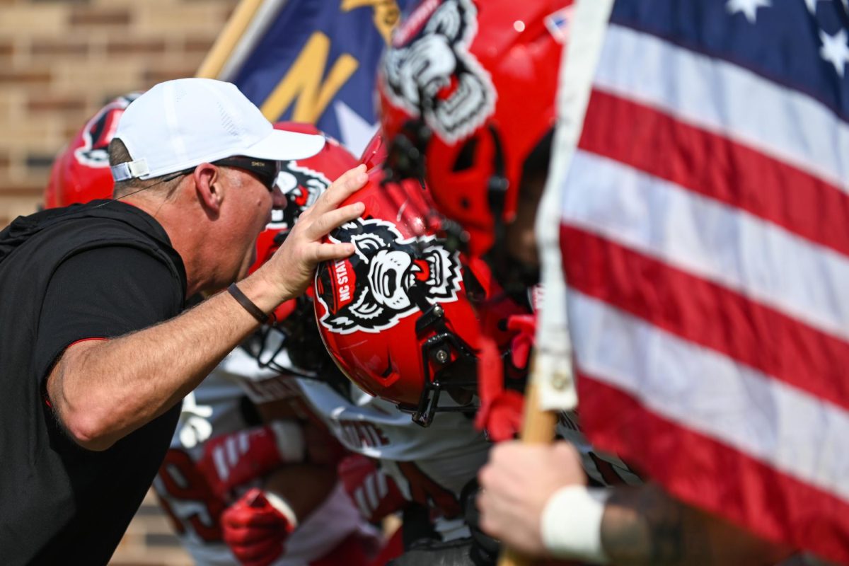 Head coach Dave Doeren leads the team out before the game against Duke at Wallace Wade Stadium on Saturday, Sept 20. 2025. The Wolfpack had five total touchdowns. NC State fell to Duke 45-33.