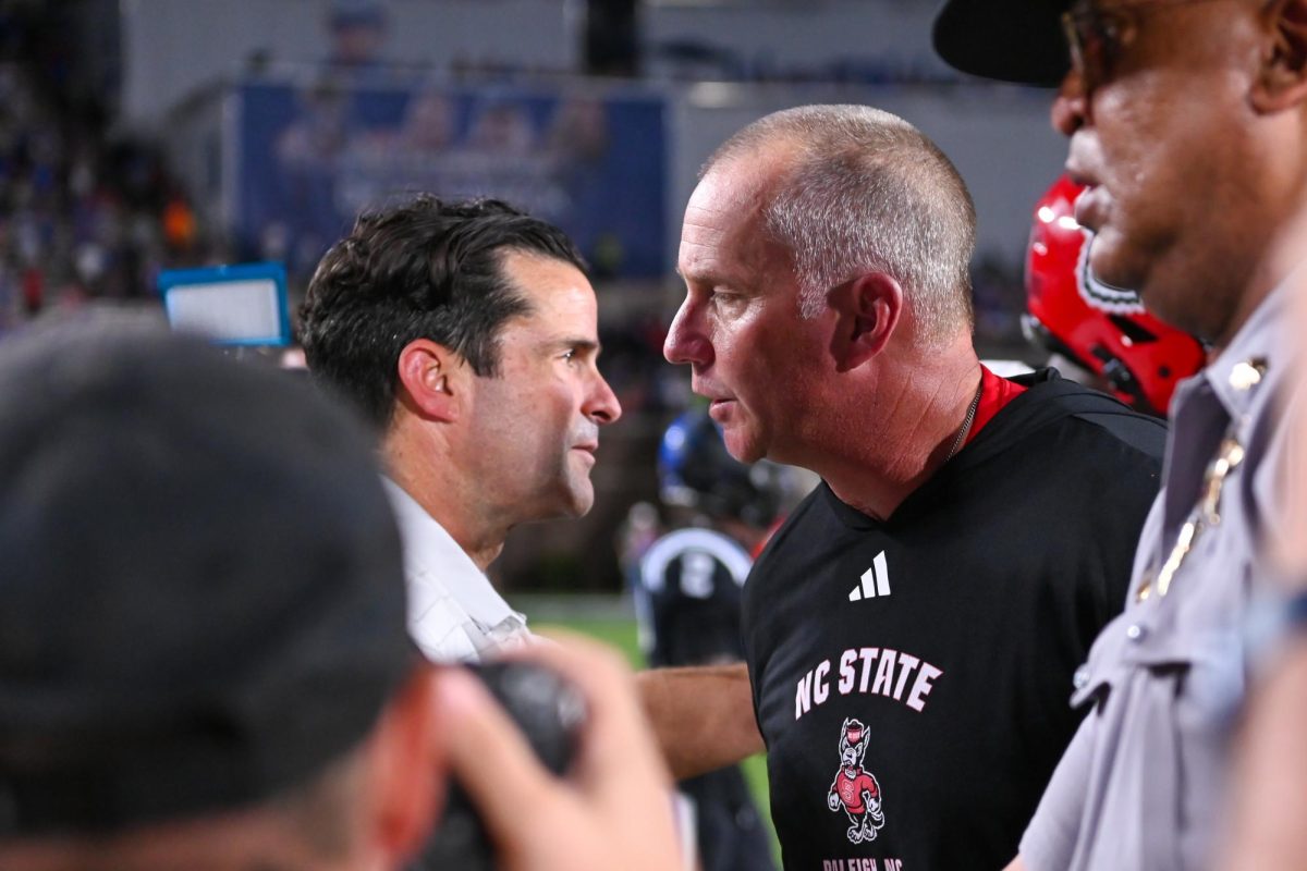 Head coach Dave Doeren shakes hands with Manny Diaz after the game against Duke at Wallace Wade Stadium on Saturday, Sept 20. 2025. The Wolfpack had five total touchdowns. NC State fell to Duke 45-33.