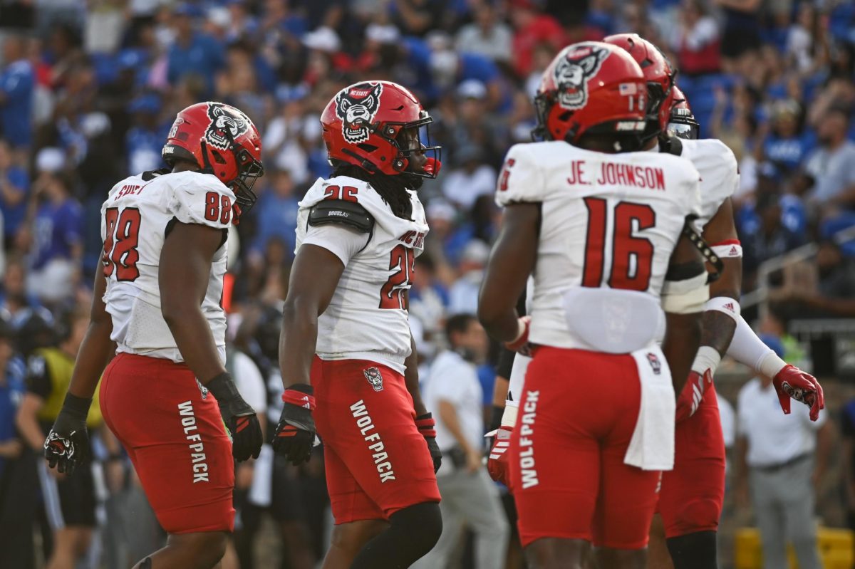 Redshirt sophomore defensive end Isaiah Shirley, redshirt junior defensive end Joseph Adedire, and graduate safety JJ Johnson express frustration after the opponent team scores a touchdown during the game against Duke at Wallace Wade Stadium on Saturday, Sept. 20, 2025. NC State lost to Duke 45-33.