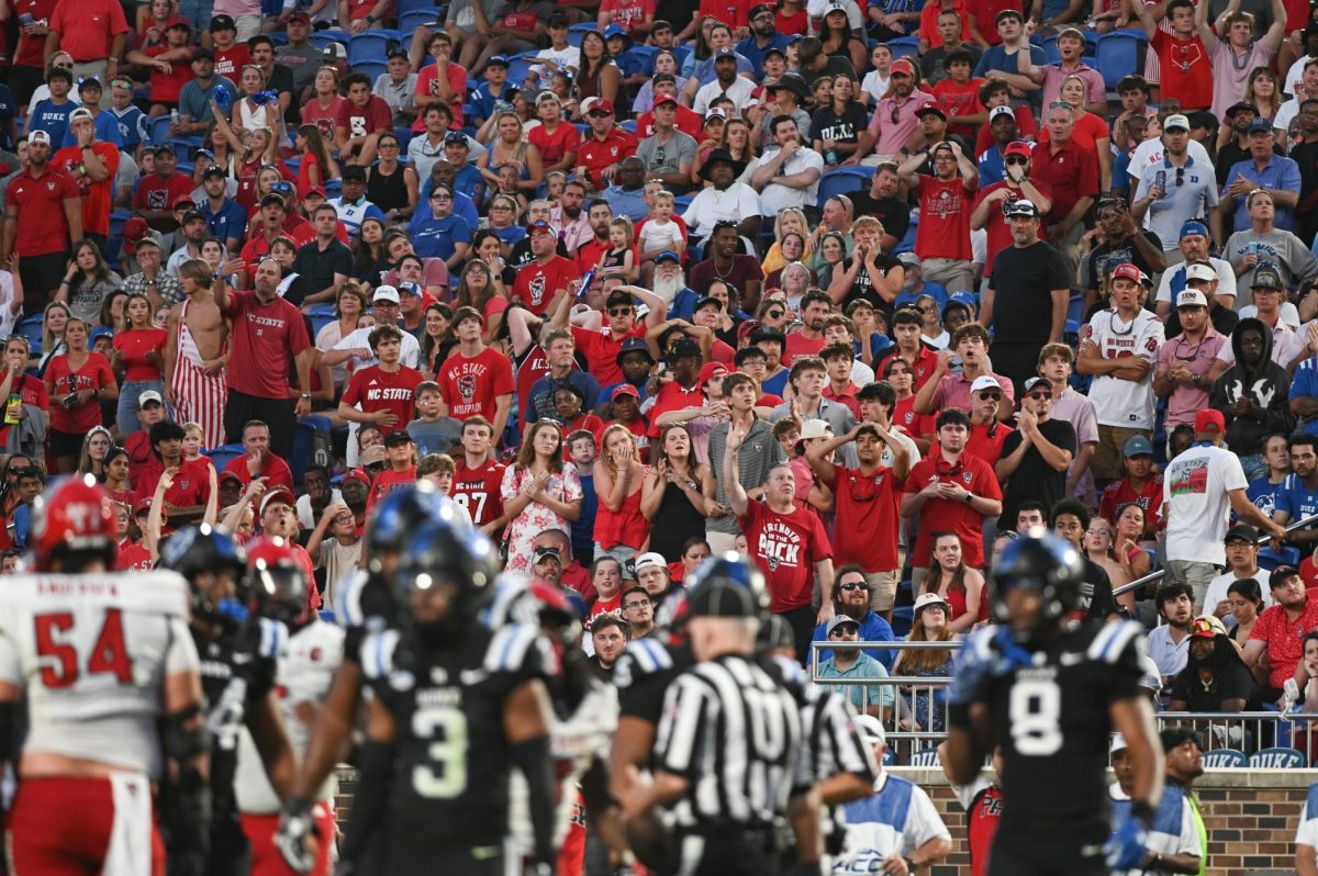 Wolfpack fans react as a play is under review during the game against Duke at Wallace Wade Stadium on Saturday, Sept. 20, 2025. NC State fell to Duke 45-33.