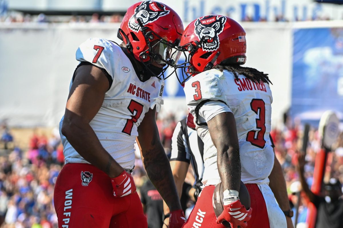 Senior tight end Justin Joly and redshirt-sophomore running back Hollywood Smothers celebrate after a touchdown during the game against Duke at Wallace Wade Stadium on Saturday, Sept 20. 2025. Anderson and Smothers had 227 combined yards. NC State fell to Duke 45-33.