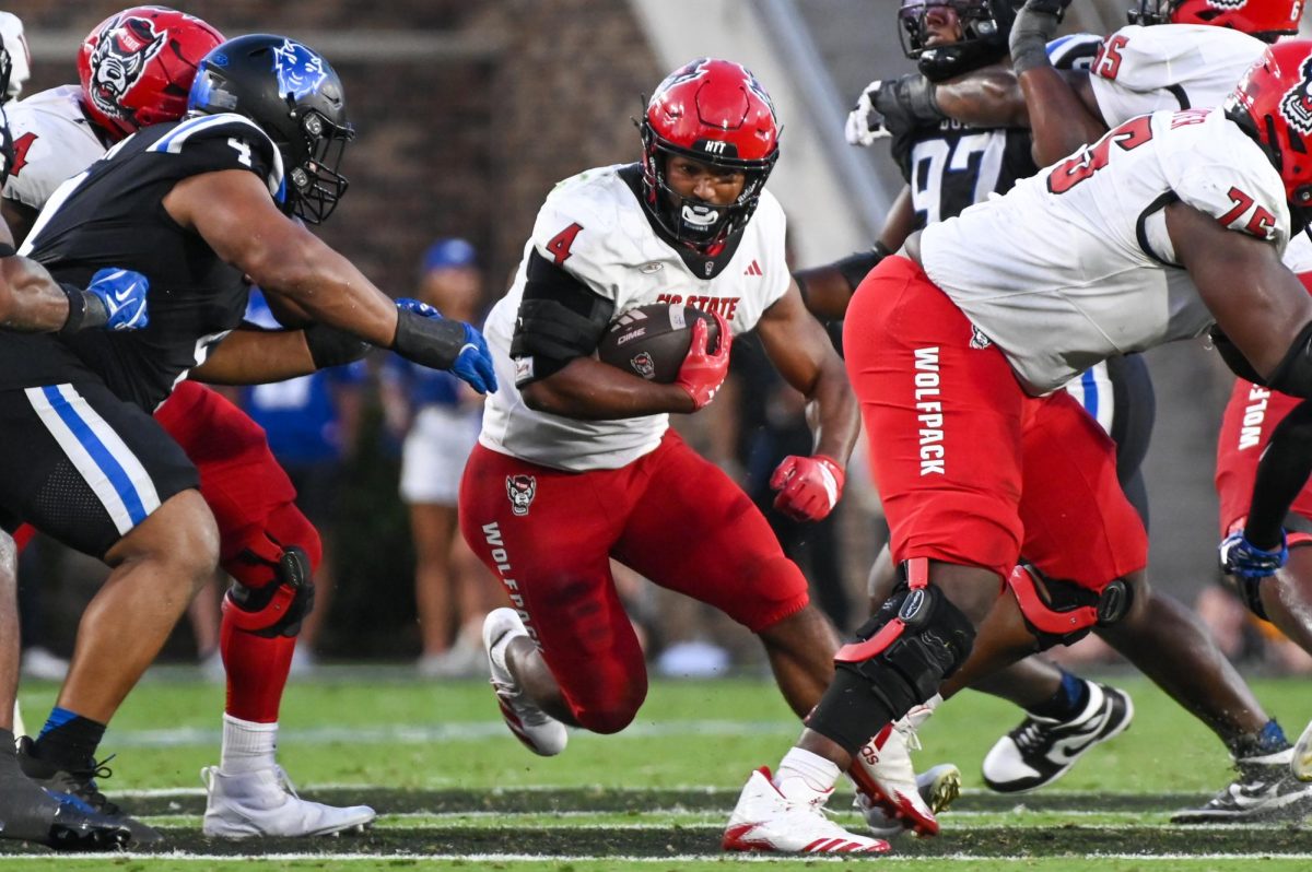 Redshirt-freshman running back Jayden "Duke" Scott runs through a hole in the pocket during the game against Duke at Wallace Wade Stadium on Saturday, Sept 20. 2025. Scott had 35 yards on seven carries. NC State fell to Duke 45-33.