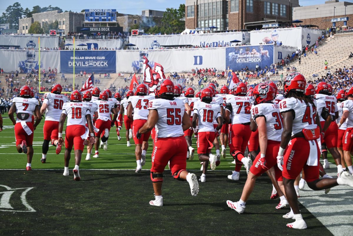 The NC State Football team enters the stadium before the game against Duke at Wallace Wade Stadium on Saturday, Sept. 20, 2025. NC State lost to Duke 45-33.